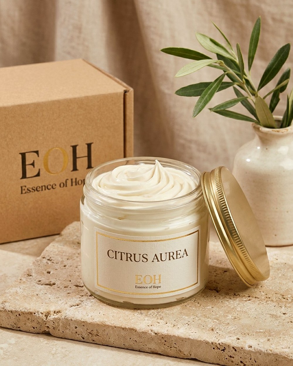EOH Citrus Aurea whipped body butter in a glass jar with gold lid